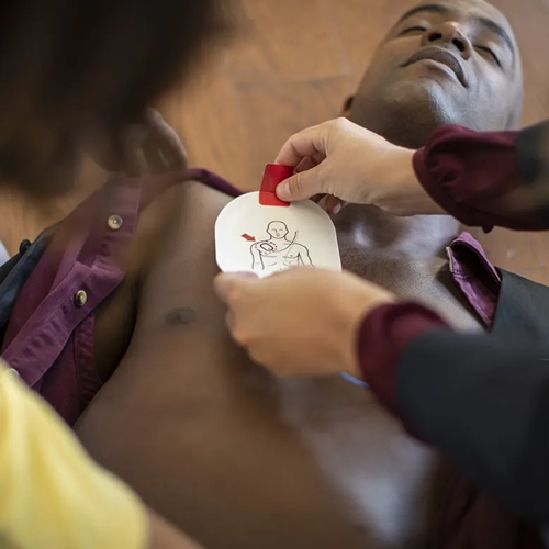 aed electrode pad being applied to man